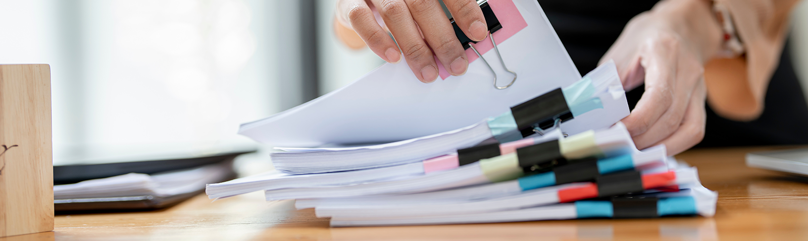 A view of a lady, organising papers