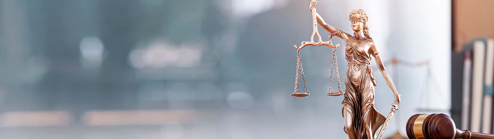 A statue of lady justice, holding scales