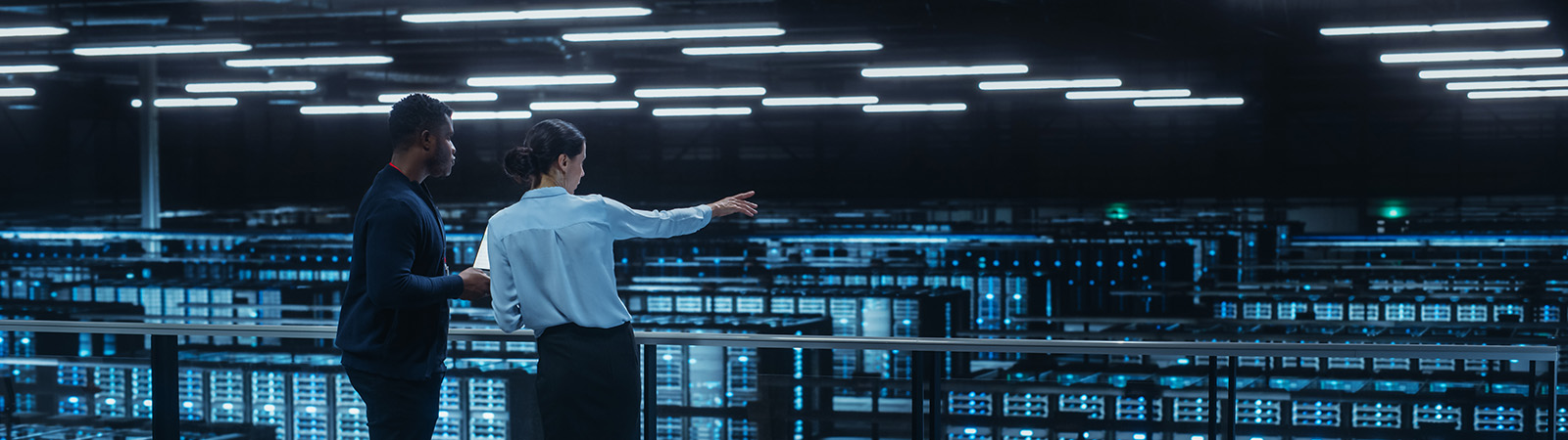 Two engineers in a data centre